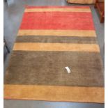 A thick pile tan, salmon pink & green striped rug - 235cm x 149cm. COLLECT ONLY
