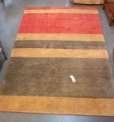 A thick pile tan, salmon pink & green striped rug - 235cm x 149cm. COLLECT ONLY