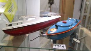 Sutcliffe tin plate clockwork Blue Racer 1 and Commodore model boats.