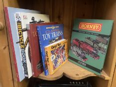 A quantity of good reference books on old toys including Corgi, hornby etc