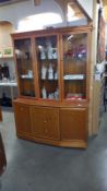 A golden oak wall unit with cut glass doors, COLLECT ONLY.