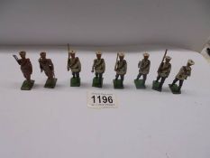 Eight pre-war Britain's soldiers with articulated arms.
