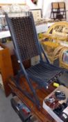 A vintage folding campaign rocking chair painted and re-covered