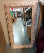 A pink & gilt framed mirror - 43cm x 77cm, COLLECT ONLY