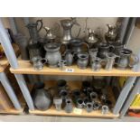 A good quantity of antique pewter small tankards etc