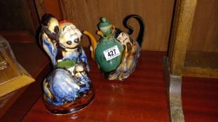 A Chinese figural pottery teapot & a figure
