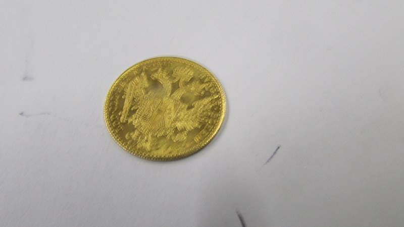 A 1915 Franc IOS I-D-G Avstriae Imperator pure gold coin, 3.5 grams. - Image 3 of 3