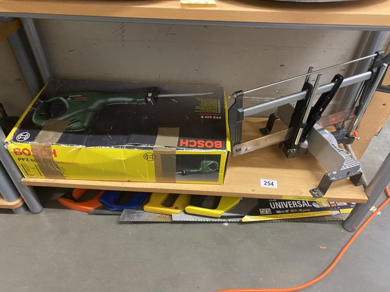 A Bosch PFZ 600E all purpose saw, quantity of hand saws etc (COLLECT ONLY)