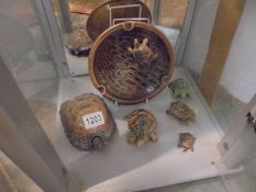 A large Wade tortoise ashtray and five small Wade tortoises.