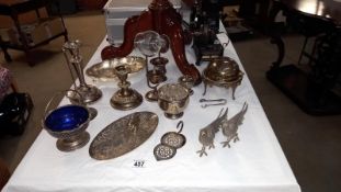 A good selection of vintage silver plate including candlesticks, pheasants etc