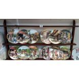 A set of 12 boxed Royal Doulton collectors plates 'Old country crafts' & a display shelf. COLLECT