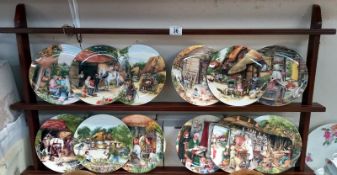 A set of 12 boxed Royal Doulton collectors plates 'Old country crafts' & a display shelf. COLLECT