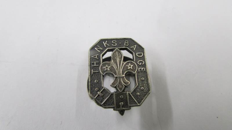 A silver AFS badge and another silver badge. - Image 3 of 3