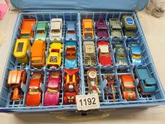 A Matchbox carry case with 48 cars including Corgi Juniors, most in very good condition.