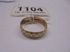 A gold wedding ring, size , 1.7 grams.