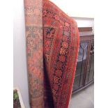 A red patterned Mossoul rug, COLLECT ONLY.