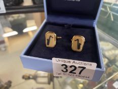 A boxed pair of Wedgwood saxophone cufflinks