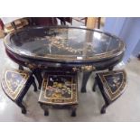 A large oval black lacquered coffee table with six small nesting tables, COLLECT ONLY.