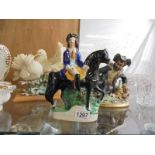 A Staffordshire figure, a Capo-di-monte figure and a dove group.