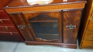 A dark wood stained music cabinet with slide out compartments, COLLECT ONLY