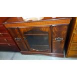 A dark wood stained music cabinet with slide out compartments, COLLECT ONLY