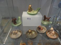 Three Wade pipe stands and four animal pin dishes.
