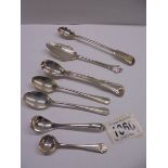 Seven assorted silver spoons, 124 grams.