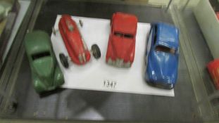 A clockwork Mettoy die cast car, a tin plate Renault, a racing car and a Chad Valley car.