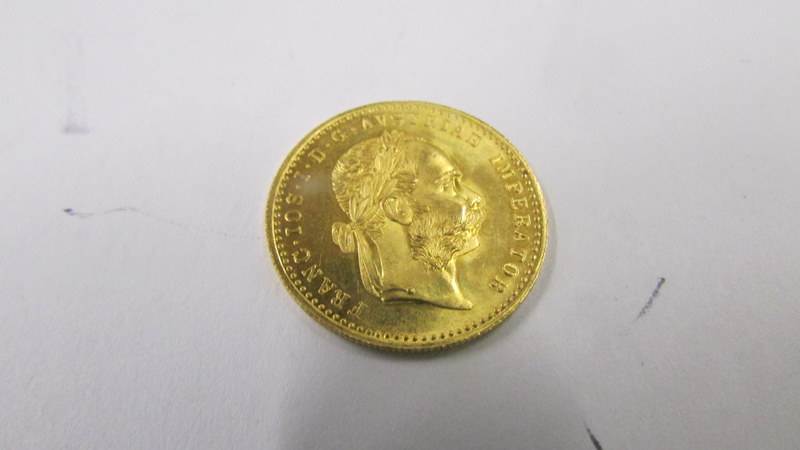 A 1915 Franc IOS I-D-G Avstriae Imperator pure gold coin, 3.5 grams. - Image 2 of 3