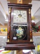 An early 20th century wall clock. COLLECT ONLY