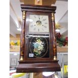 An early 20th century wall clock. COLLECT ONLY
