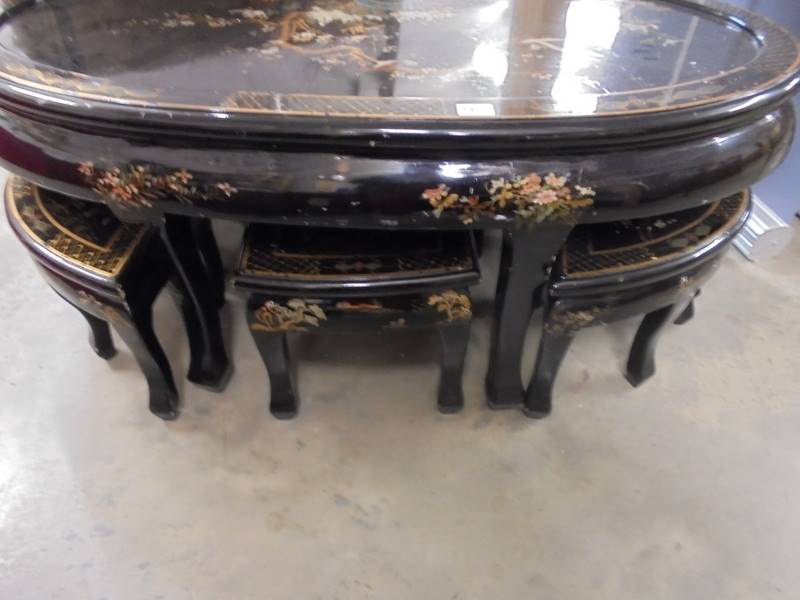 A large oval black lacquered coffee table with six small nesting tables, COLLECT ONLY. - Image 4 of 4