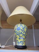 An oriental ceramic table lamp with shade. COLLECT ONLY.