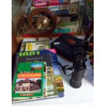 A pair of Halina 16 x 50 binoculars, a ships wheel clock and a quantity of books on walks in Britain