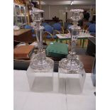 A pair of good quality silver plate candlesticks.