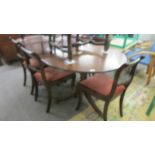 An oval double pedestal extending dining table and six chairs, COLLECT ONLY.