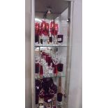 Three shelves of assorted red glass, COLLECT ONLY.