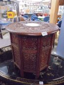 An Asian carved wood occasional table with centre inlay (slight damage to inlay) COLLECT ONLY.