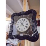 A 19th century 8 day wall clock with mother of pearl decoration.