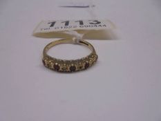 A Gold ring set red and white stones, size M, 1.4 grams.