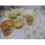 Seven pieces of Clarice Cliff (one a/f) and other ceramics.