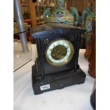 A black slate mantel clock. COLLECT ONLY.