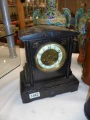 A black slate mantel clock. COLLECT ONLY.