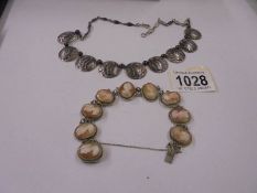 A Siamese silver necklace and a silver cameo bracelet.