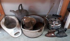 A vintage small galvanised watering can, jam pan, cast iron flat irons & balance scales etc.