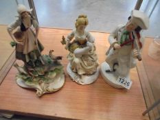 A Capo di monte girl with chicken (a/f), a Staffordshire figure of a fiddler and one other figure.