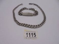 A heavy silver neck chain and a silver identity bracelet. 134 grams.