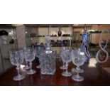 A heavy cut glass decanter and 8 glasses