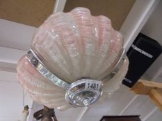 An art deco clam shell ceiling light.