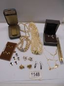A mixed lot including faux pearls, Dunhill lighter, silver gilt name necklace, collar studs etc.,